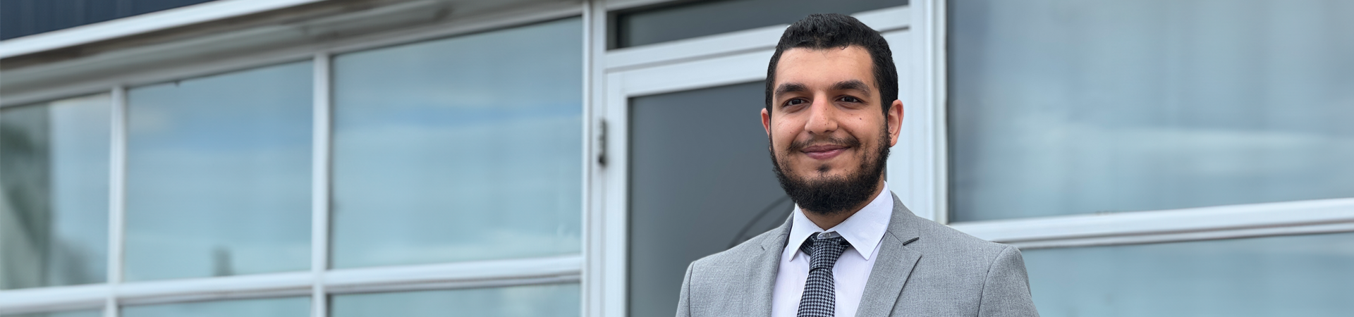 A picture of Abdulla smiling.