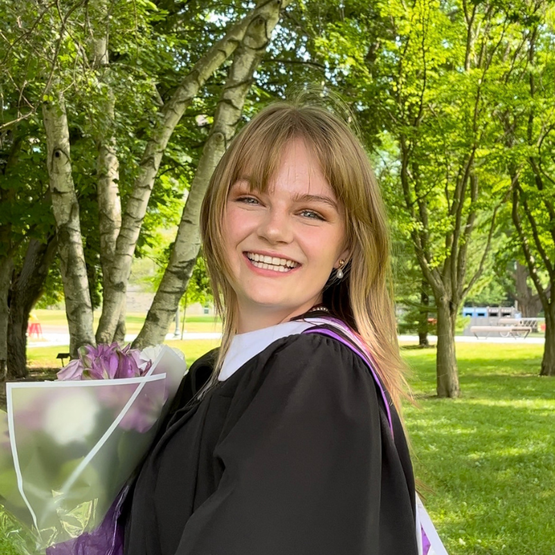 A photo of Faith smiling.