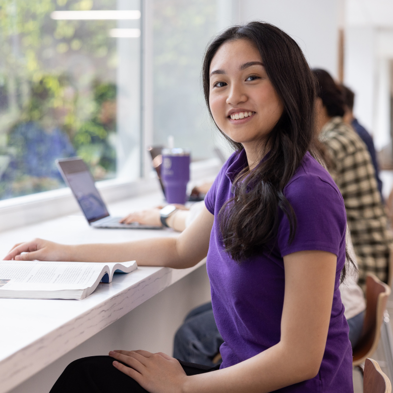 A student smiling